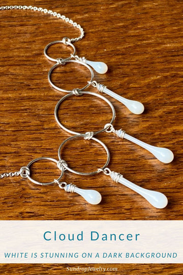 Cloud Dancer white jewelry is stunning on a dark background